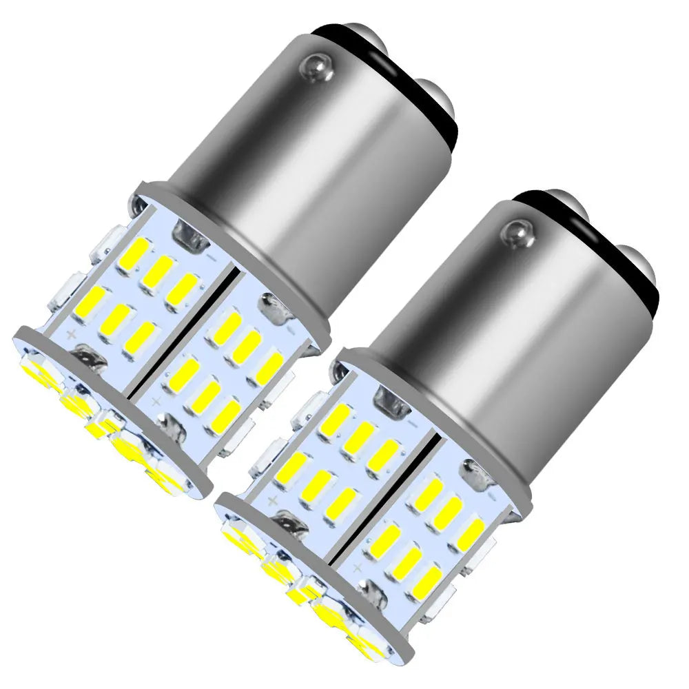 A pair of silver LED bulbs designed for brake, reverse, and turn signals.