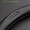 Close-up of a black leather steering wheel cover with the Mazda logo embossed on it.