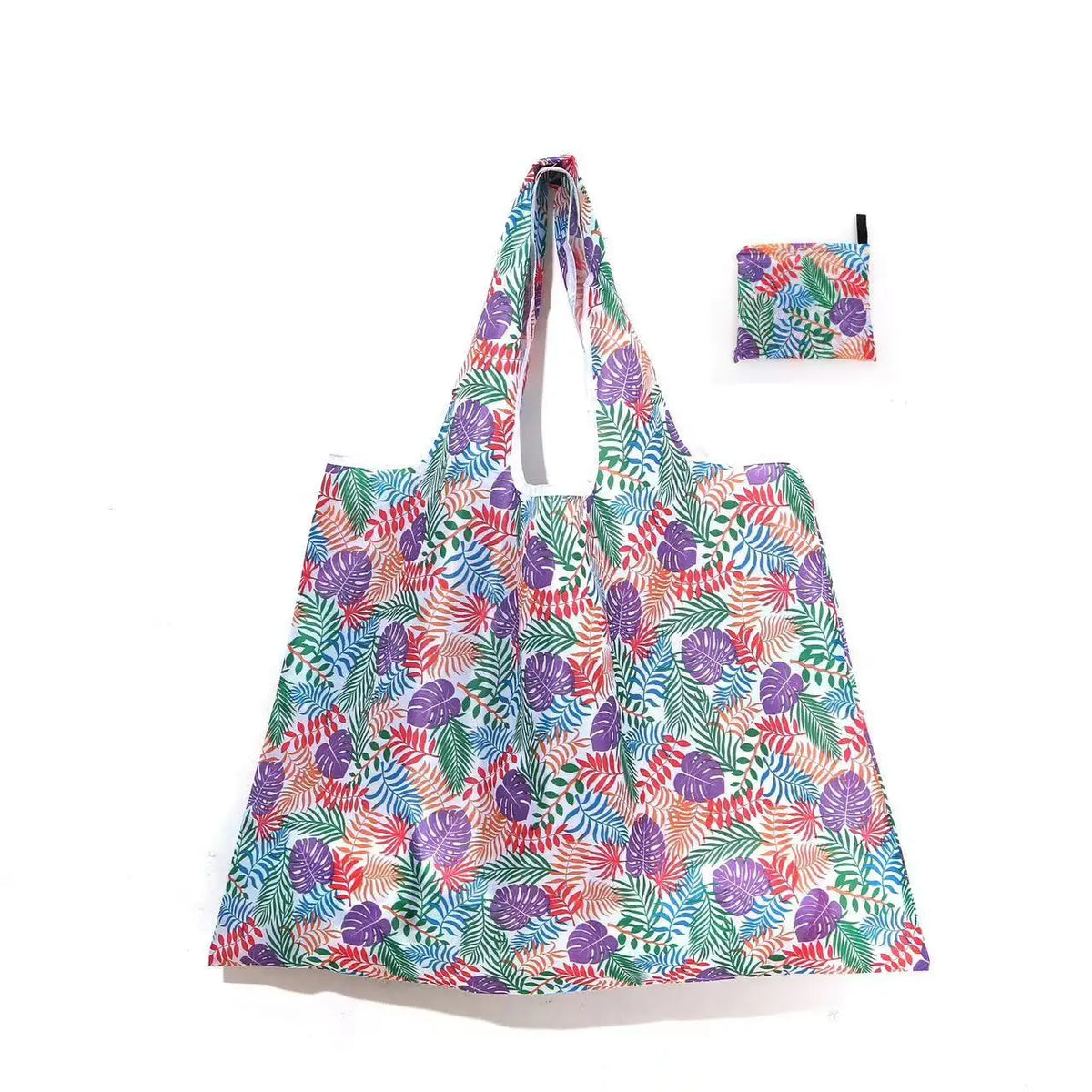 A reusable shopping tote bag featuring a floral pattern in shades of purple, green, and pink, with an attached small pouch.
