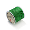 A spool of bright green 0.8mm nylon macramé cord for jewelry making with a label indicating 72#