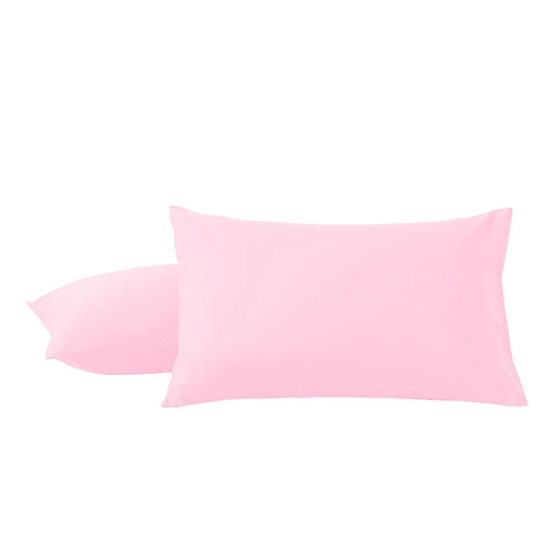 A pair of pink microfiber pillowcases with envelope closure stacked together.