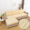 A beige waterproof sofa cushion cover displayed on a light gray sofa in a well-lit room.