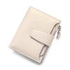 A beige genuine leather RFID blocking bifold wallet shown from above.