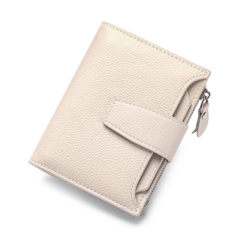 A beige genuine leather RFID blocking bifold wallet shown from above.