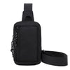 Black compact canvas crossbody bag with a strap shown from the back