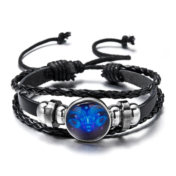 Black leather wrap bracelet featuring a glowing blue zodiac sign charm.