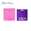 A pink silicone resin mold for creating badge backings and keychains is shown next to a purple glitter mold.