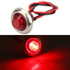 A close-up view of a round red LED side marker light assembly with a silver housing and red wiring.