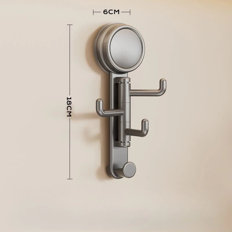 A silver, rotatable suction cup hook with a circular head and mounting bracket is shown against a light wall.