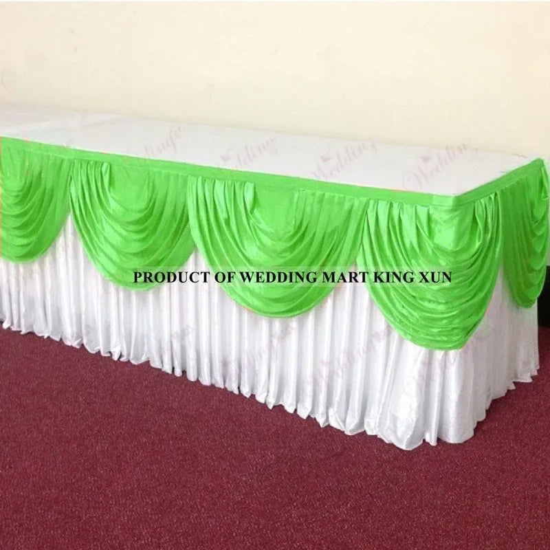 Elegant ice silk table skirt with matching top swag in white and lime green.