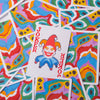 A colorful deck of poker playing cards scattered on a surface.