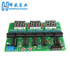 A green PCB board with eight 8-digit LED displays and various electronic components for a digital clock DIY kit.