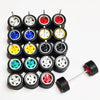 Ten pairs of 1:64 scale alloy car wheels and tires in various colors are arranged on a white background.