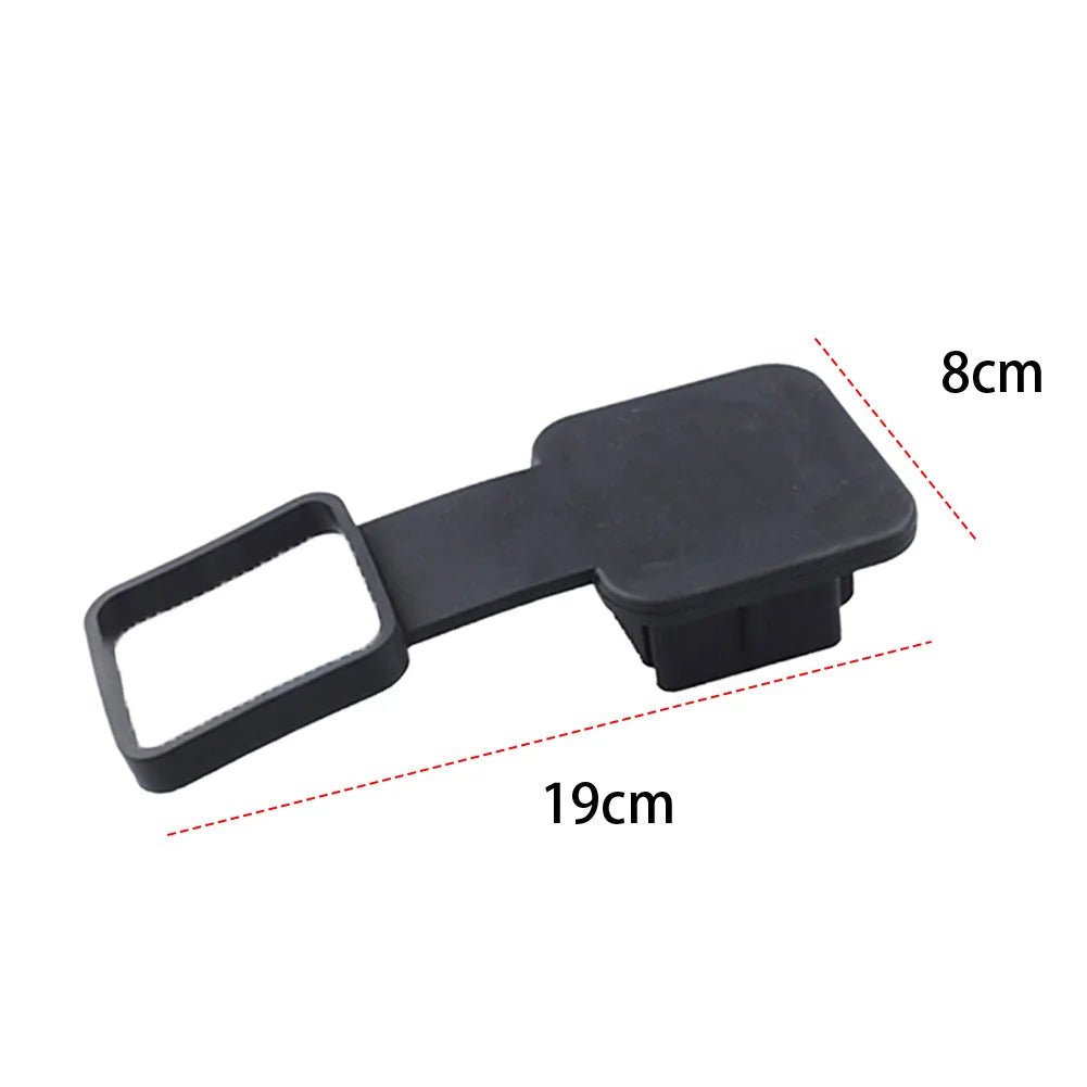 Black trailer hitch receiver cover with a flag emblem, shown from the side.