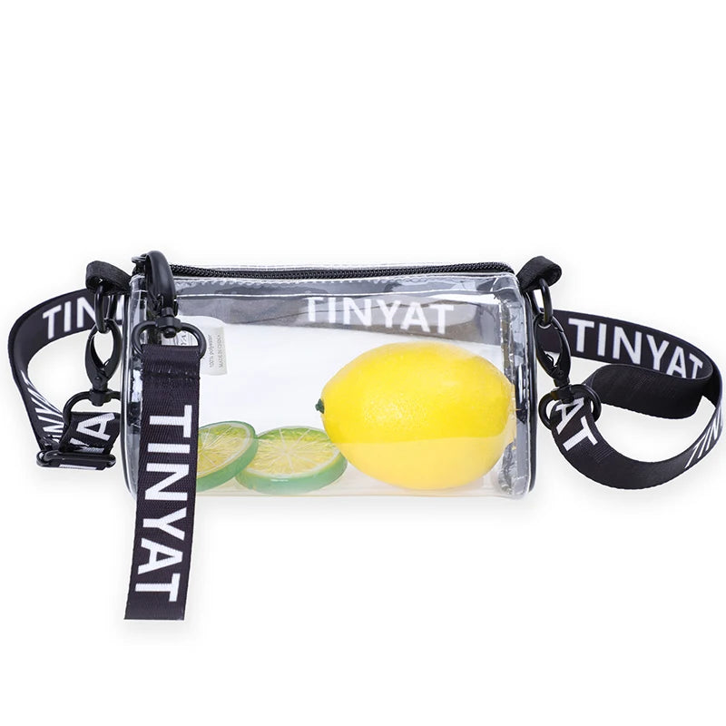 Clear crossbody bag with a yellow lemon inside and black adjustable strap