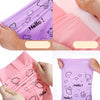 Close-up of purple self-sealing mailing bags featuring a white cloud and hello bear design being held by hands.