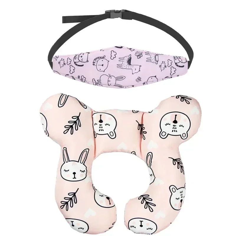 Pink baby car seat head and neck support pillow with a safety strap