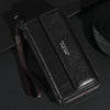 Portefeuille pochette noir homme PU avec sangle marron sur une surface sombre.