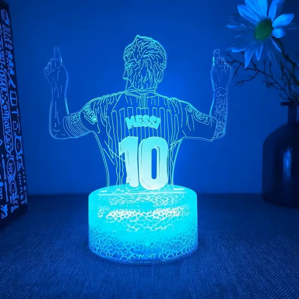 A glowing blue silhouette of a person with arms raised and the number 10 is displayed on a light-up sports night light.