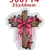 A wooden cross with a pink bow and floral decorations on a white background.