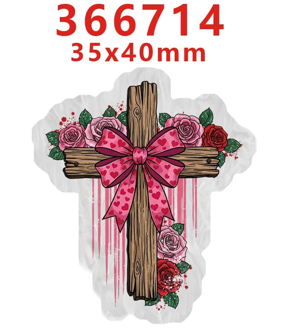 A wooden cross with a pink bow and floral decorations on a white background.