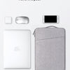A gray waterproof laptop sleeve with a handle, along with a wireless mouse and a smartphone.