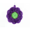 A spherical cleaning sponge made of purple and green acrylic fibers.