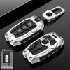 A silver protective key fob cover for Hyundai and Kia models shown in various angles.