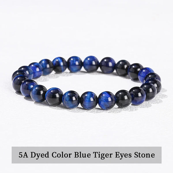 A bracelet made of 5A Dyed Color Blue Tiger Eyes stones in various shades of blue and black.