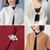 Close-up of vintage bowknot rhinestone clothing clips used to fasten scarves and sweaters on knitwear.