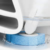 A white toilet brush and holder set with a blue, textured cleaning head submerged in water.
