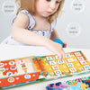 A baby is interacting with a colorful Montessori quiet book featuring letters and numbers, alongside wooden letter pieces.