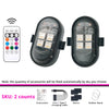 Two black remote control RGB LED strobe lights with accessories for vehicle use