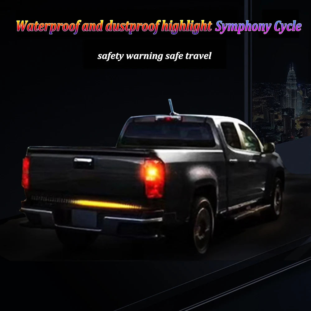 An RGB LED highlight symphony cycle waterproof and dustproof light bar mounted on the tailgate of a black pickup truck.