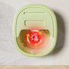 A light green foldable foot bath tub with a lid is shown, demonstrating a sauna effect inside.
