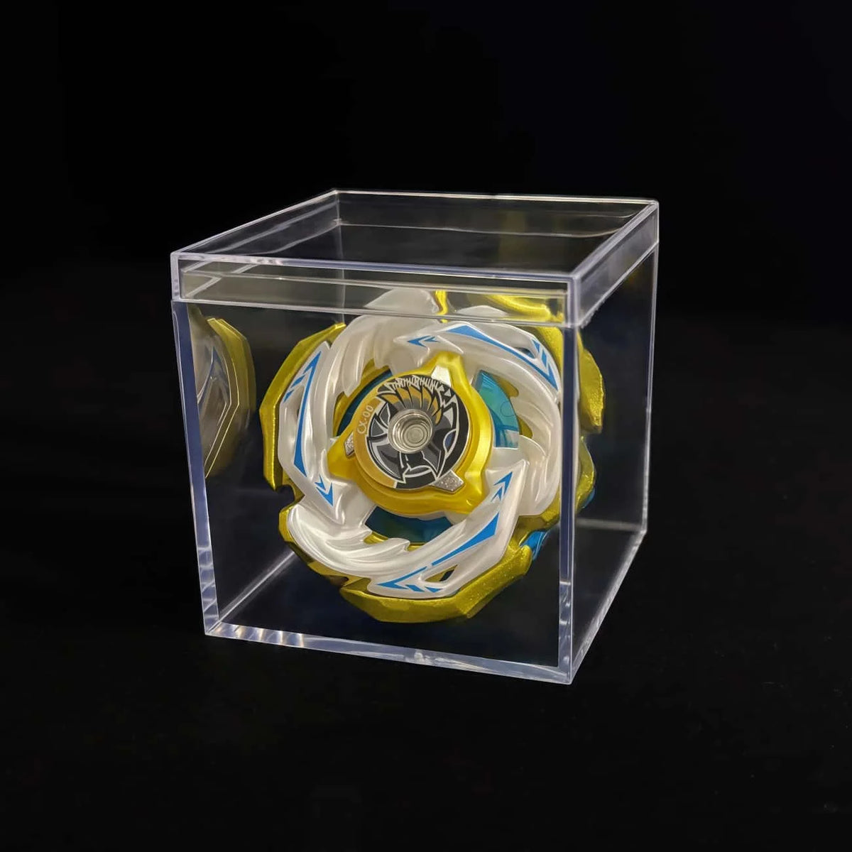 A Valkyrie Volt S4-70V metal spinning top with launcher displayed inside a clear plastic box.