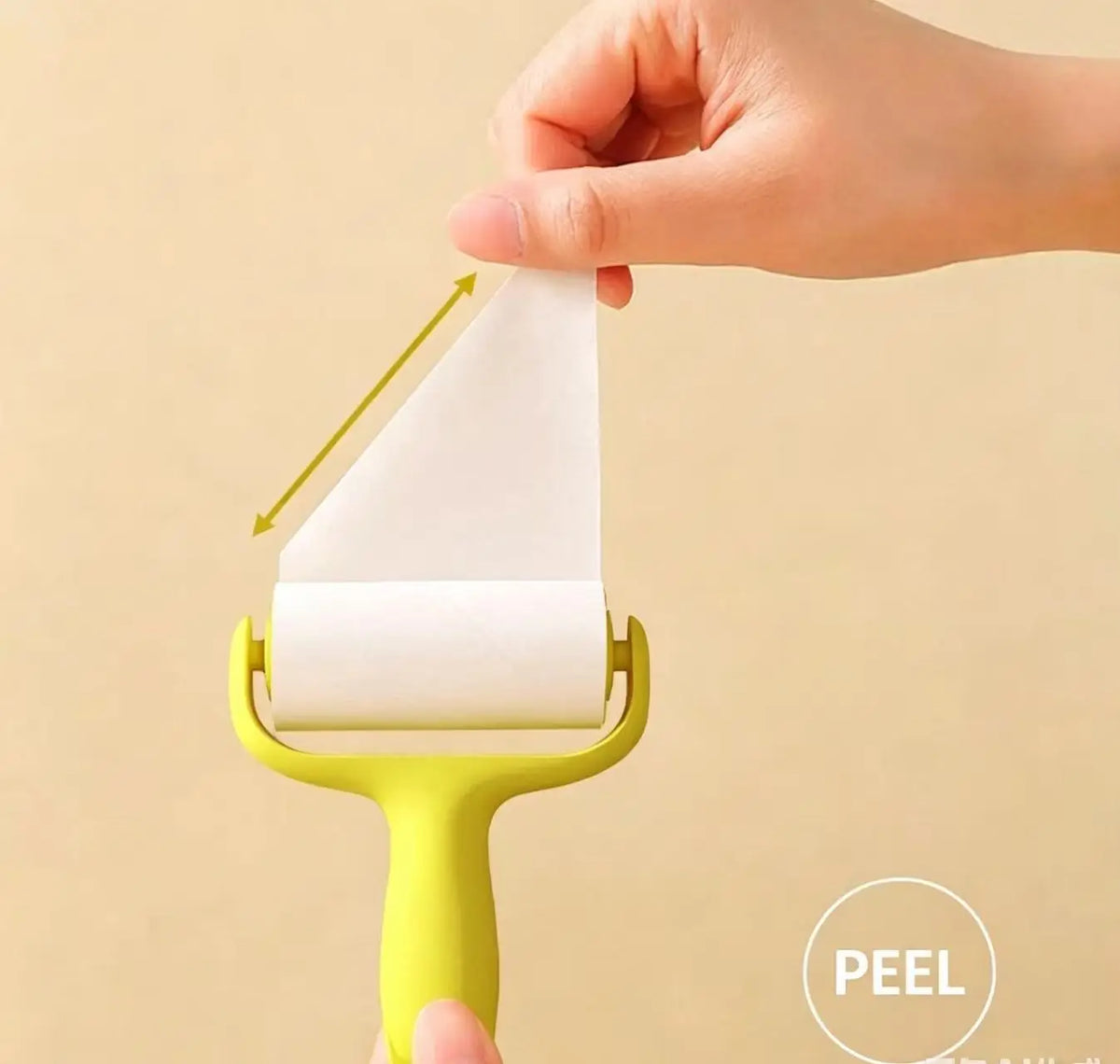 A hand is using a yellow mini portable lint roller to remove lint from fabric.