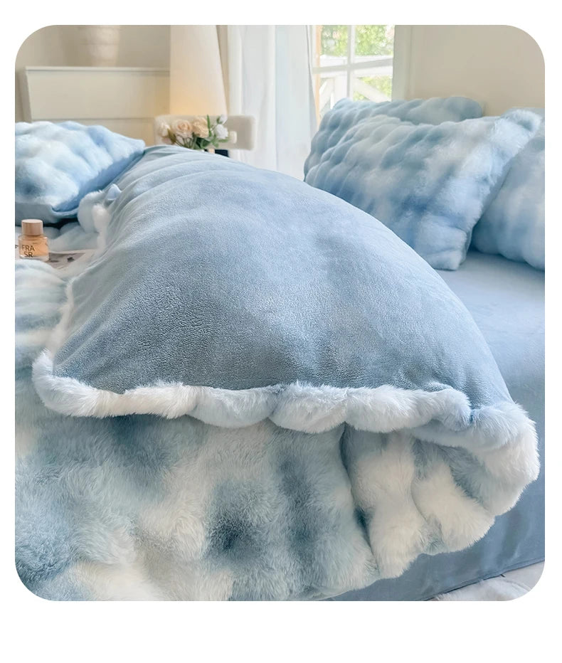 A light blue and white fluffy fleece duvet cover with a rabbit design displayed on a bed.