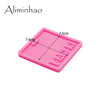 Pink silicone resin mold with a rectangular shape used for making badge backings and keychains
