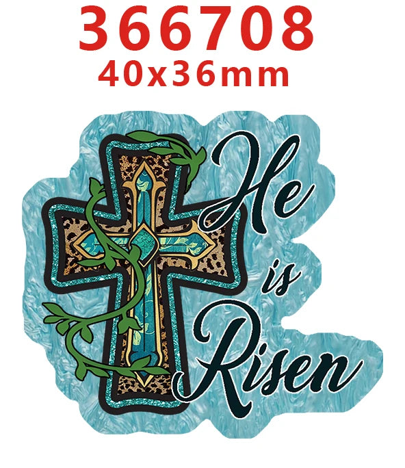 A teal acrylic hair bow decoration featuring a gold cross design with green foliage and the text He is Risen.