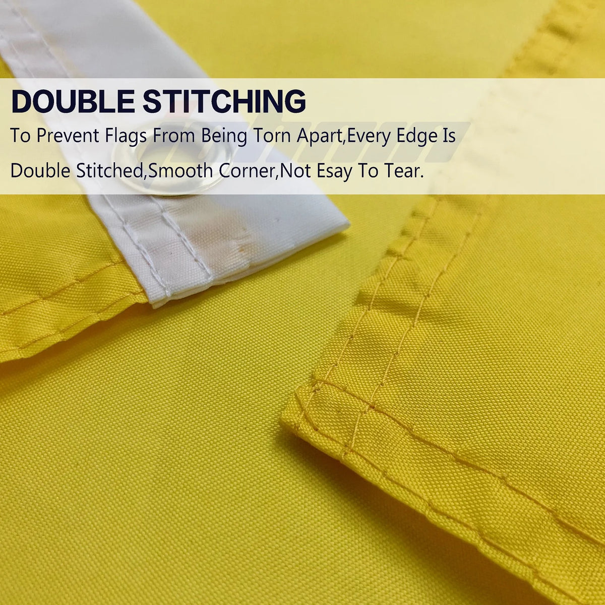 Close-up of yellow fabric showing double stitching on a white edge, demonstrating a durable seam.