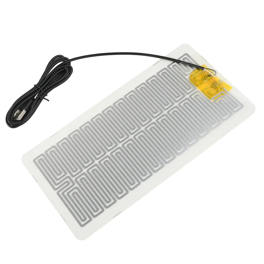 A yellow heating pad with a black cord is shown, designed for desk and plant warmth.