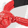 A close-up of a bright red synthetic winch rope coiled and braided, shown against a dark sleeve.