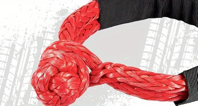 A close-up of a bright red synthetic winch rope coiled and braided, shown against a dark sleeve.