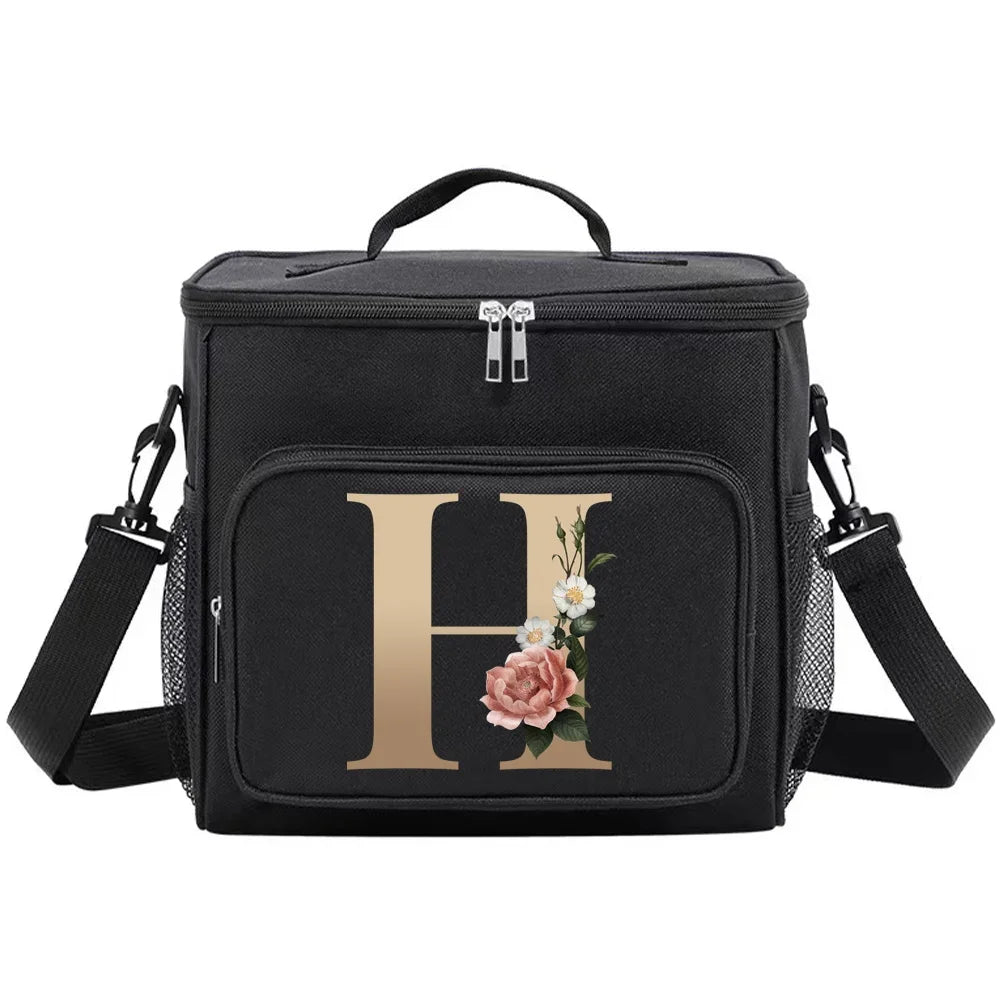 Black insulated canvas lunch bag with a gold initial H and floral design