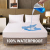 A white mattress protector is shown being filled with water, demonstrating its waterproof feature.