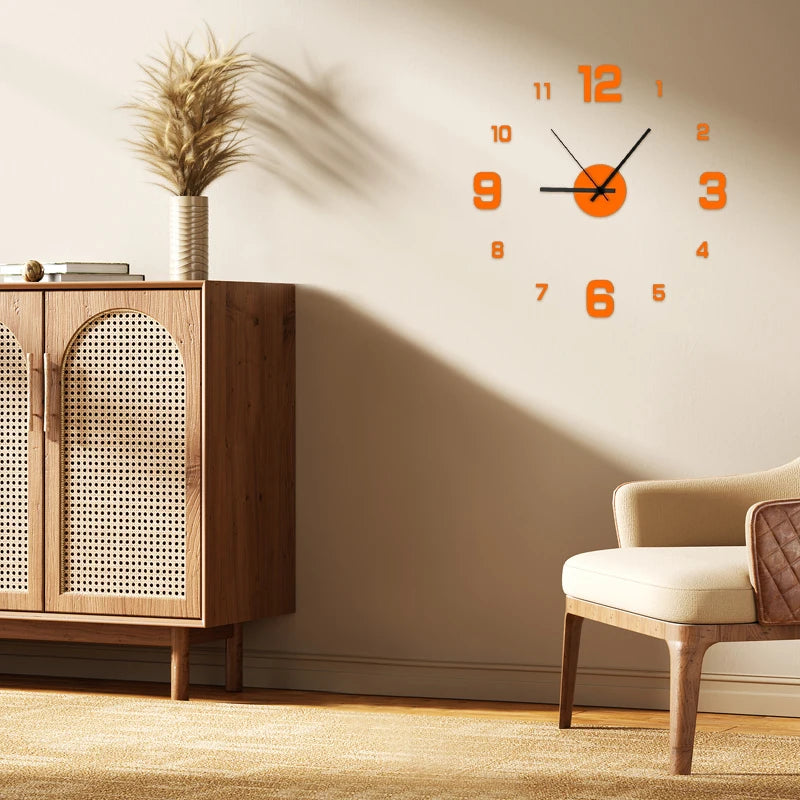 A modern wall clock with orange numerals and hands is displayed on a beige wall next to wooden furniture.
