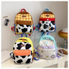 A collection of five cute cow print backpacks in various colors and patterns displayed against a white wall.