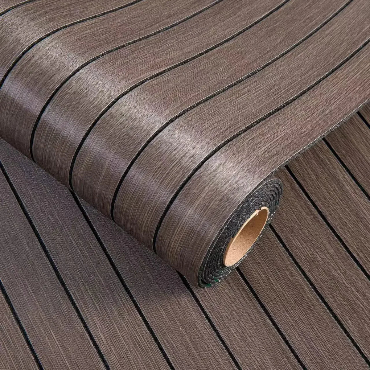 Roll of brown wood grain peel-and-stick wallpaper featuring a vertical stripe pattern.