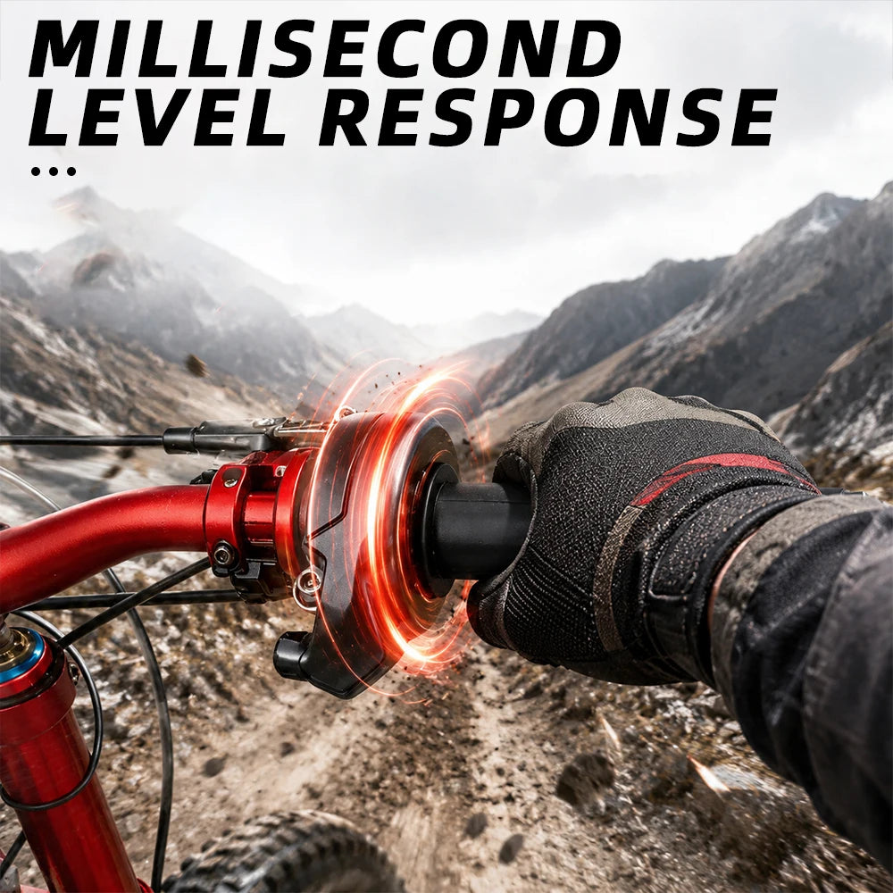 Close-up of a red electric bike throttle grip with a glowing effect, held by a gloved hand in a mountainous outdoor setting.